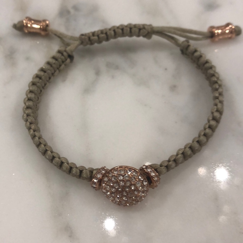 Tan and rose gold bracelet.